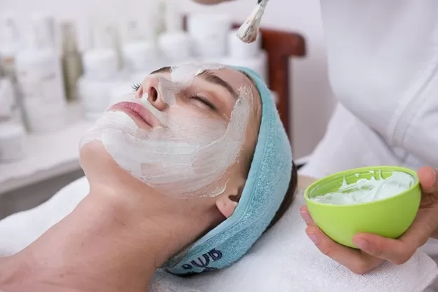 a woman getting facial done